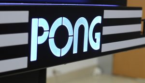 Closeup of Pong name on table